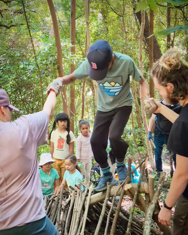 Untitled Wilderness Skills Community Day children and families playing in nature